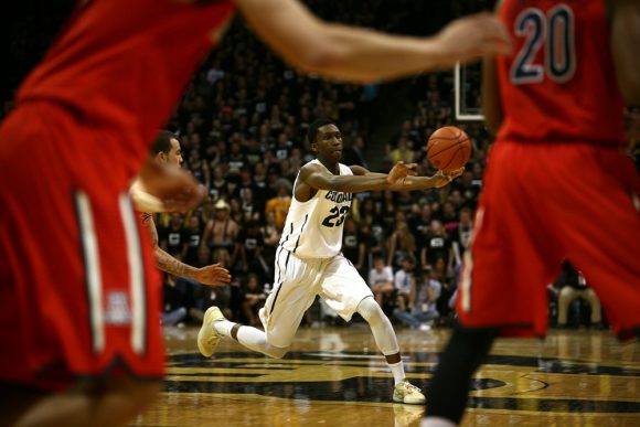 Colorado freshman guard Jaron Hopkins (23) passes the ball to a teammate during an NCAA college basketball game between the Colorado Buffaloes and the No. 4 Arizona Wildcats at the Coors Events Center, Saturday, Feb. 22, 2014, in Boulder, Colo. (Kai Casey/CU Independent)