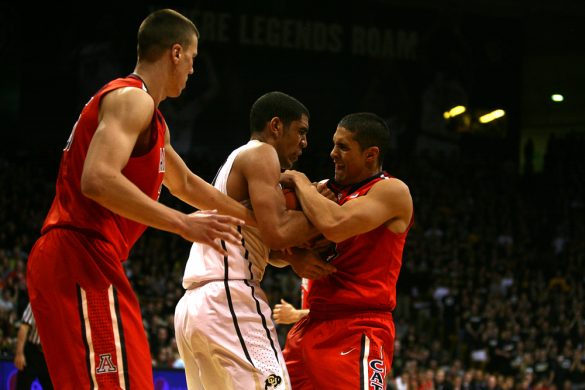 Colorado's Josh Scott (40) fights with Arizona's Nick Johnson (13) for a loose ball during an NCAA college basketball game between the Colorado Buffaloes and the No. 4 Arizona Wildcats at the Coors Events Center, Saturday, Feb. 22, 2014, in Boulder, Colo. (Kai Casey/CU Independent)