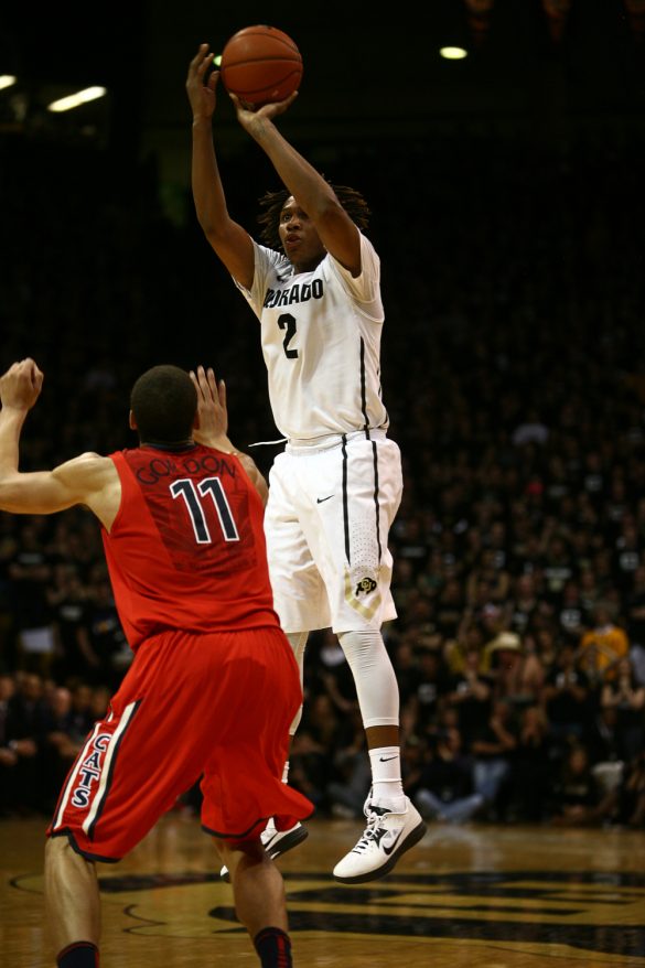 Colorado forward Xavier Johnson (2) shoots a three-pointer past Arizona's Aaron Gordon (11) during an NCAA college basketball game between the Colorado Buffaloes and the No. 4 Arizona Wildcats at the Coors Events Center, Saturday, Feb. 22, 2014, in Boulder, Colo. (Kai Casey/CU Independent)