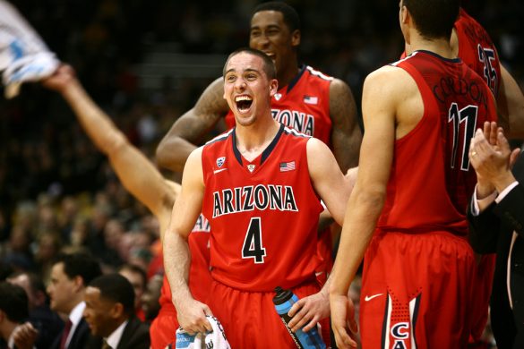 Arizona's T.J. McConnell (4) celebrates with his teammates after a bench player scored late in an NCAA college basketball game between the Colorado Buffaloes and the No. 4 Arizona Wildcats at the Coors Events Center, Saturday, Feb. 22, 2014, in Boulder, Colo. (Kai Casey/CU Independent)