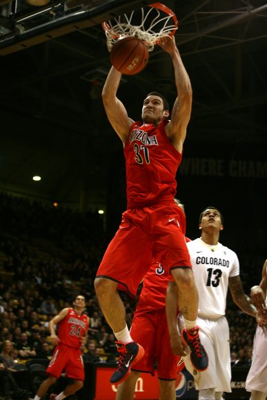 Arizona's Matt Korcheck (31) dunks the ball late in an NCAA college basketball game between the Colorado Buffaloes and the No. 4 Arizona Wildcats at the Coors Events Center, Saturday, Feb. 22, 2014, in Boulder, Colo. (Kai Casey/CU Independent)