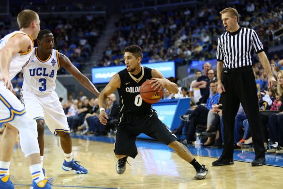 Colorado guard Askia Booker looks for an open lane between the Bruin defenders at Pauley Pavilion. (Nigel Amstock/CU Independent)