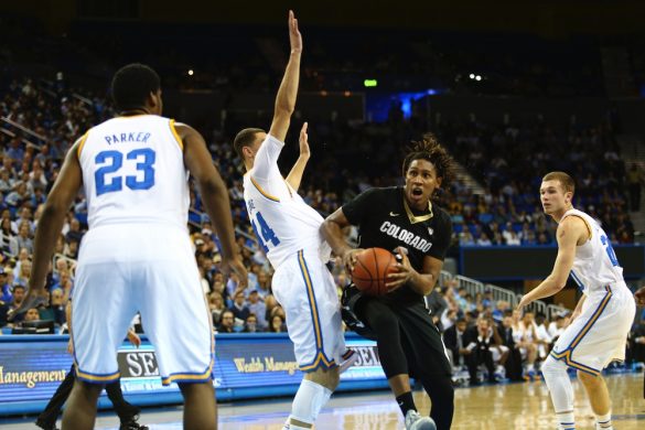 Colorado forward Xavier Johnson drives through a crowd of Bruin defenders late in the second half at Pauley Pavilion. (Nigel Amstock/CU Independent)