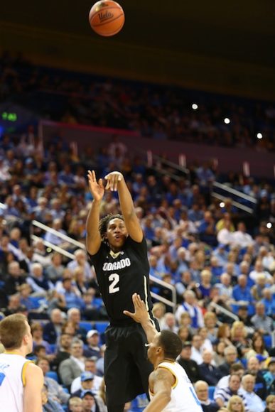 Colorado forward Xavier Johnson attempts a long 3-pointer over a Bruin defender late in the second half of play at Pauley Pavilion. (Nigel Amstock/CU Independent)