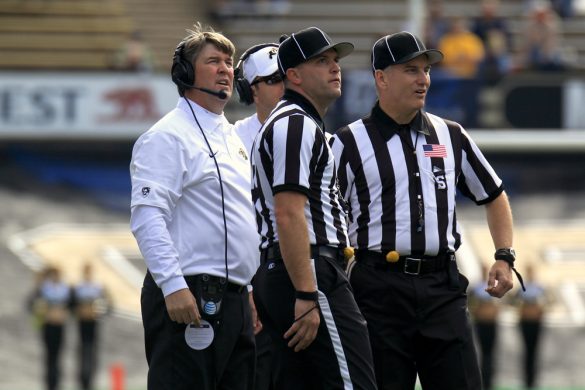 Coach Mike Macintyre confers with referees about a questionable touchdown catch by Charleston Southern's Colton Korn at the end of the 1st half of the game, Oct. 19, 2013. (Matthew Sisneros/CU Independent)