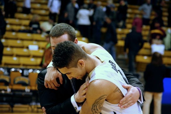 Junior guard, Askia Booker, hugs an assistant coach, celebrating his 18 point performance in the Buffs 62-51 victory over the Arizona State Sun Devils on Feb 19, 2014. (Matt Sisneros/CU Independent)