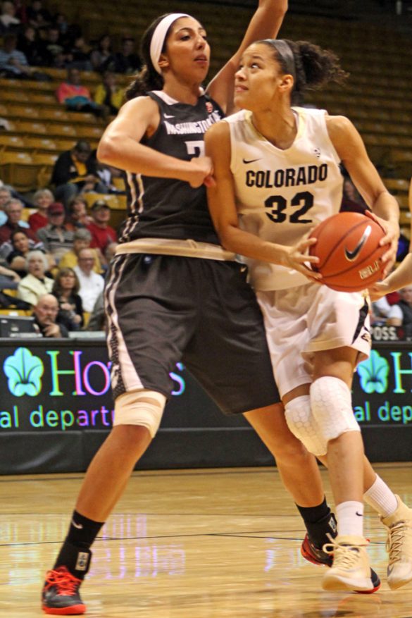 Colorado sophomore Arielle Roberson (32) looks to drive toward the basket against her defender. (Maddie Shumway/CU Independent)