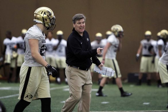 Coach Mike MacIntyre discusses a blown assignment in a drill with incoming freshman defensive back Ryan Moeller at practice on March 7, 2014. (Matt Sisneros/CU Independent)