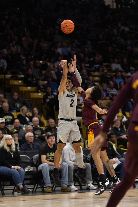 Sophomore guard KJ Simpson goes up for a three-point shot during the first half at the CU Events Center. Dec. 1, 2022. (Kara Wagenknecht/The CU Independent)