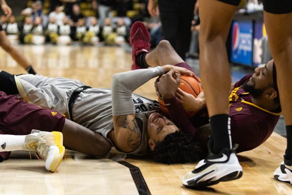Sophomore guard KJ Simpson fights for the ball during the second half at the CU Events Center. Dec. 1, 2022. (Kara Wagenknecht/The CU Independent)