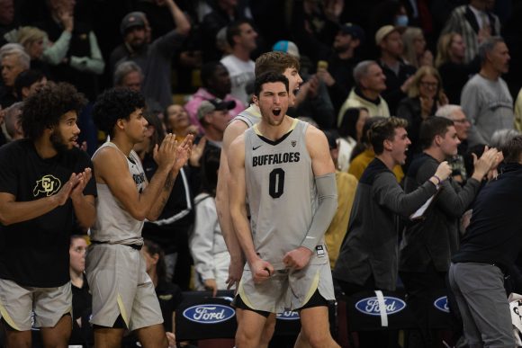Junior guard Luke O'Brien celebrates after Tristan da Silva was able to keep the ball in bounds during a defensive save at the CU Events Center. Dec. 1, 2022. (Kara Wagenknecht/The CU Independent)