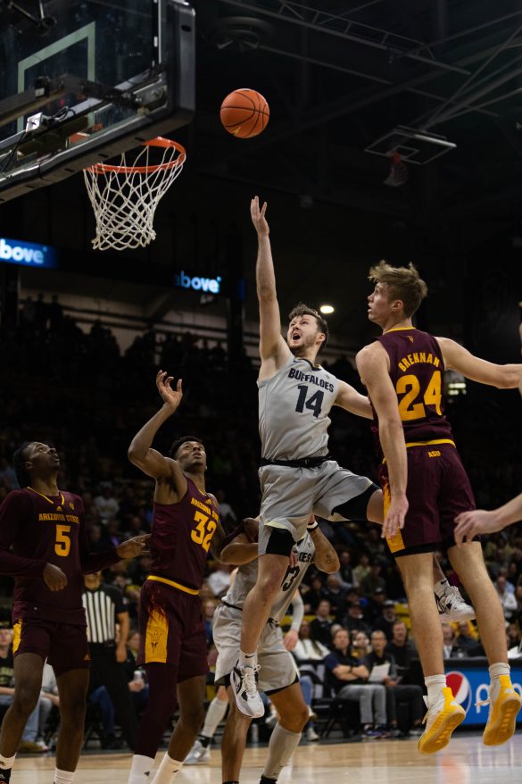 Graduate Student guard Ethan Wright shoots for a basket during the first half at the CU Events Center. Dec. 1, 2022. (Kara Wagenknecht/The CU Independent)