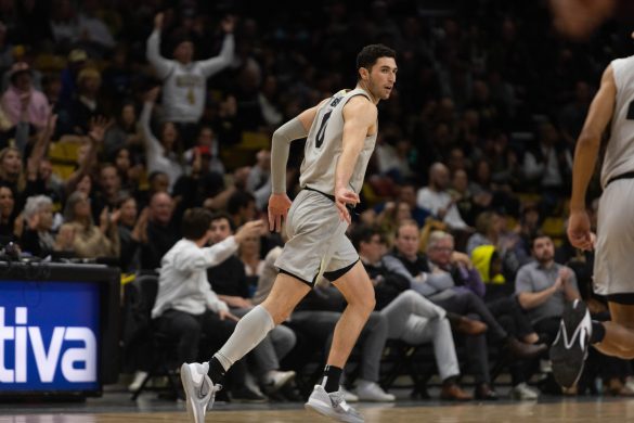 Junior guard Luke O'Brien celebrates after scoring a three-pointer during the first half to extend the Buffs lead at the CU Events Center. Dec. 1, 2022. (Kara Wagenknecht/The CU Independent)
