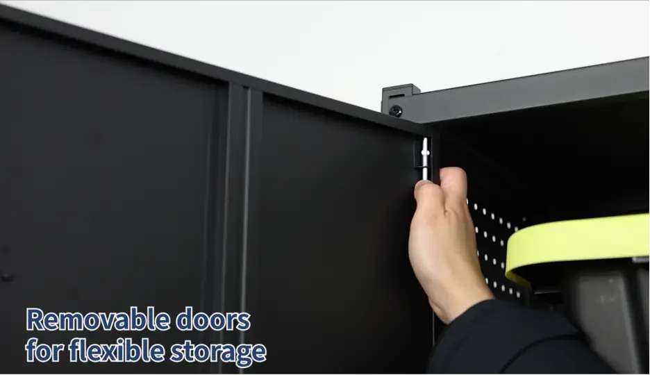 Hand adjusting pin on black cabinet with removable doors for storage flexibility