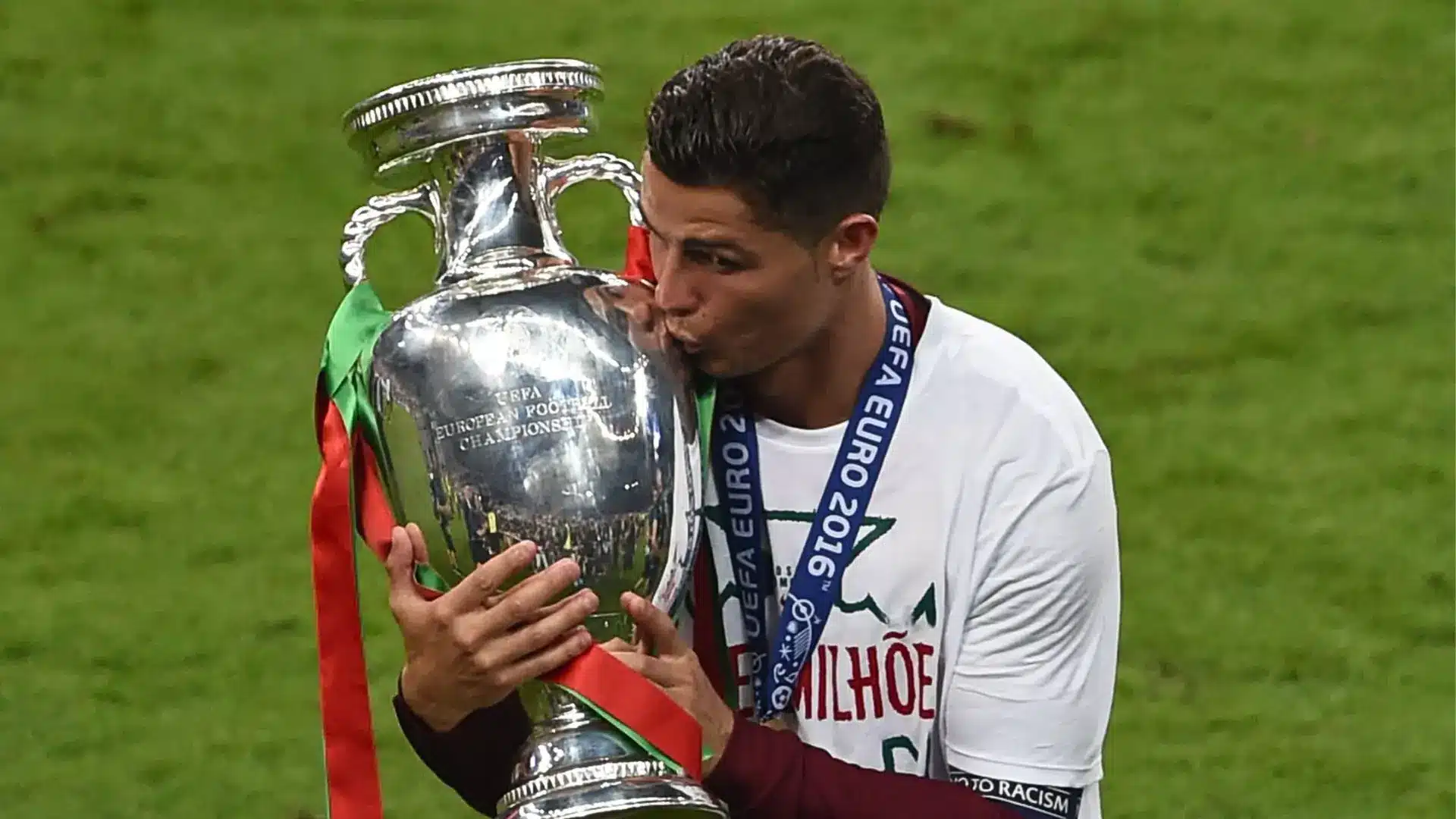 Cristiano Ronaldo kissing the UEFA Euro 2016 trophy after Portugal's historic championship victory