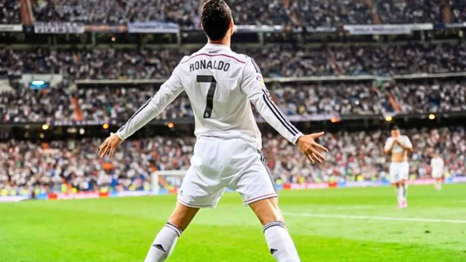 Cristiano Ronaldo number 7 celebrating in Real Madrid's white kit