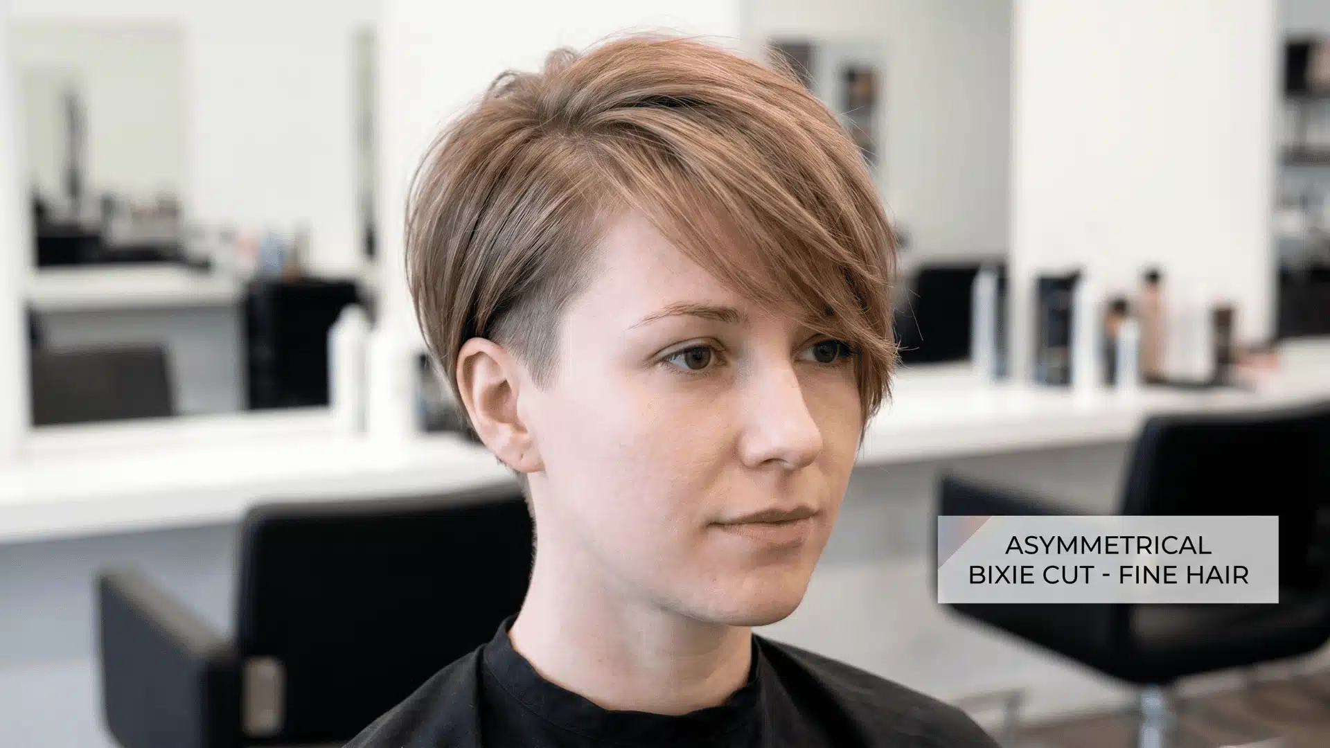 Woman with fine hair wearing asymmetrical bixie haircut with undercut and longer layers on one side