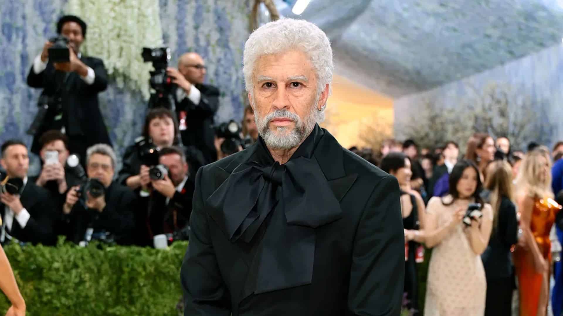 Bad Bunny wearing an elegant black Prada suit with oversized bow detail at the Met Gala 2026