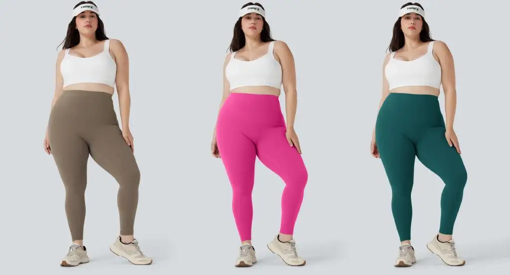 Three women in athletic outfits with different colored leggings on neutral background