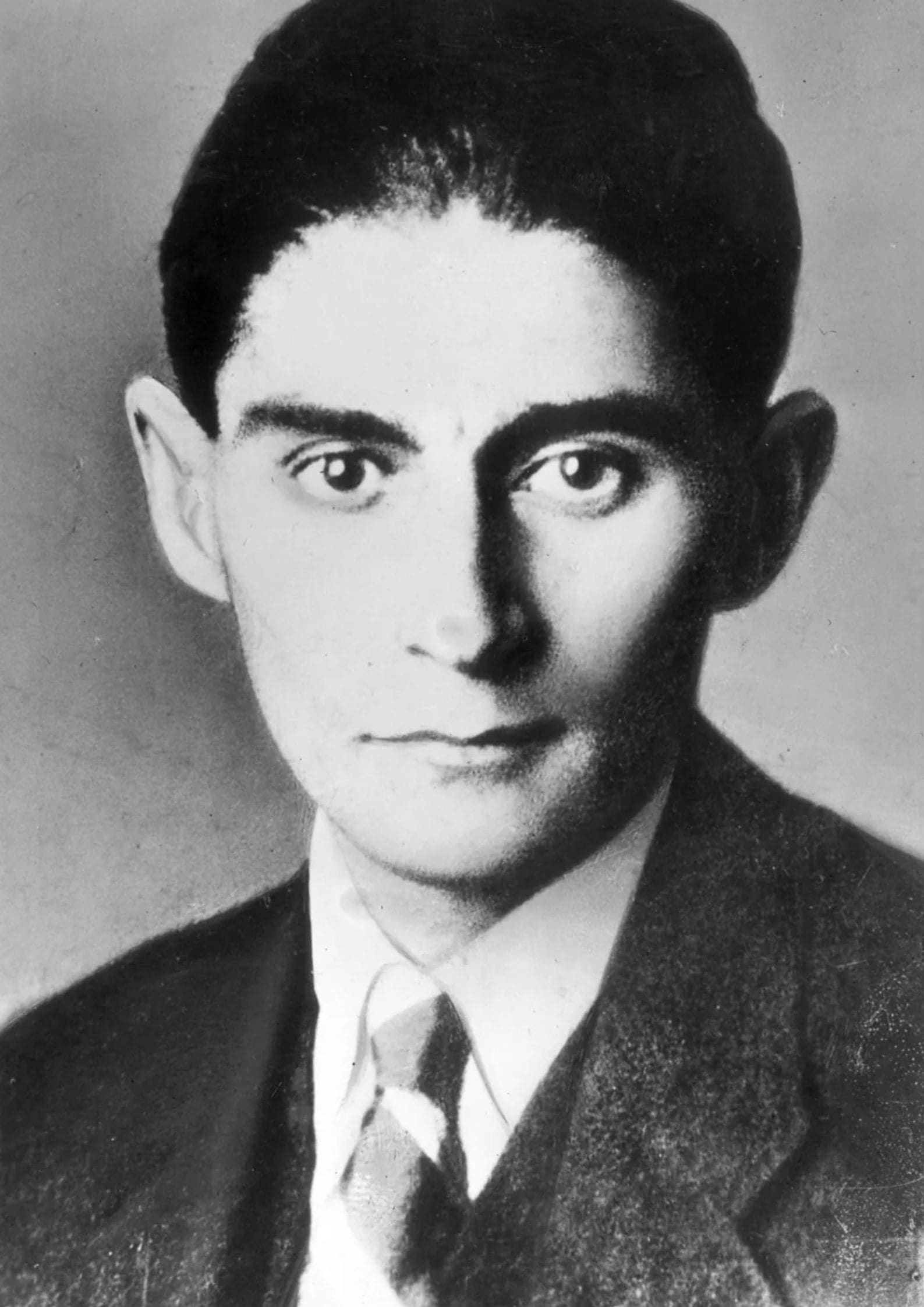 Black and white portrait photograph of Franz Kafka, Czech-Jewish novelist known for works like The Trial and The Metamorphosis (1)