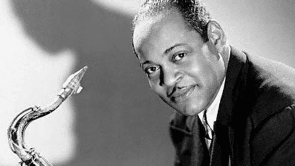 Coleman Hawkins posing for a photo while holding a sexophone