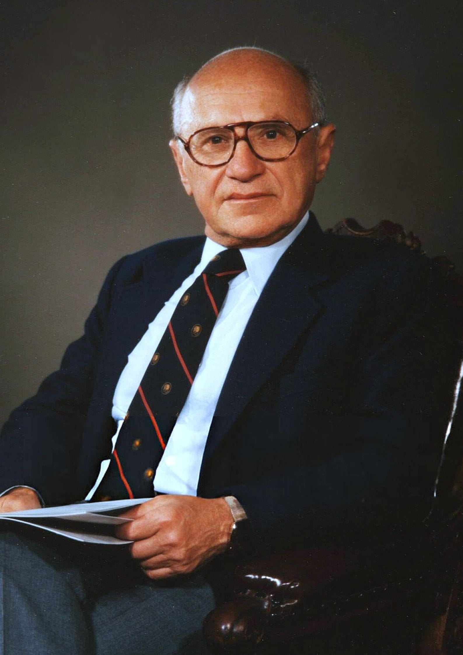 Formal portrait photograph of Milton Friedman, American economist and Nobel laureate known for his work on monetary policy and free market theory (1)