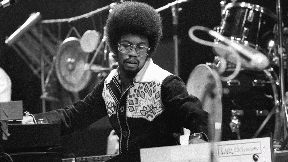 Herbie Hancock in a studio surrounded by different instruments