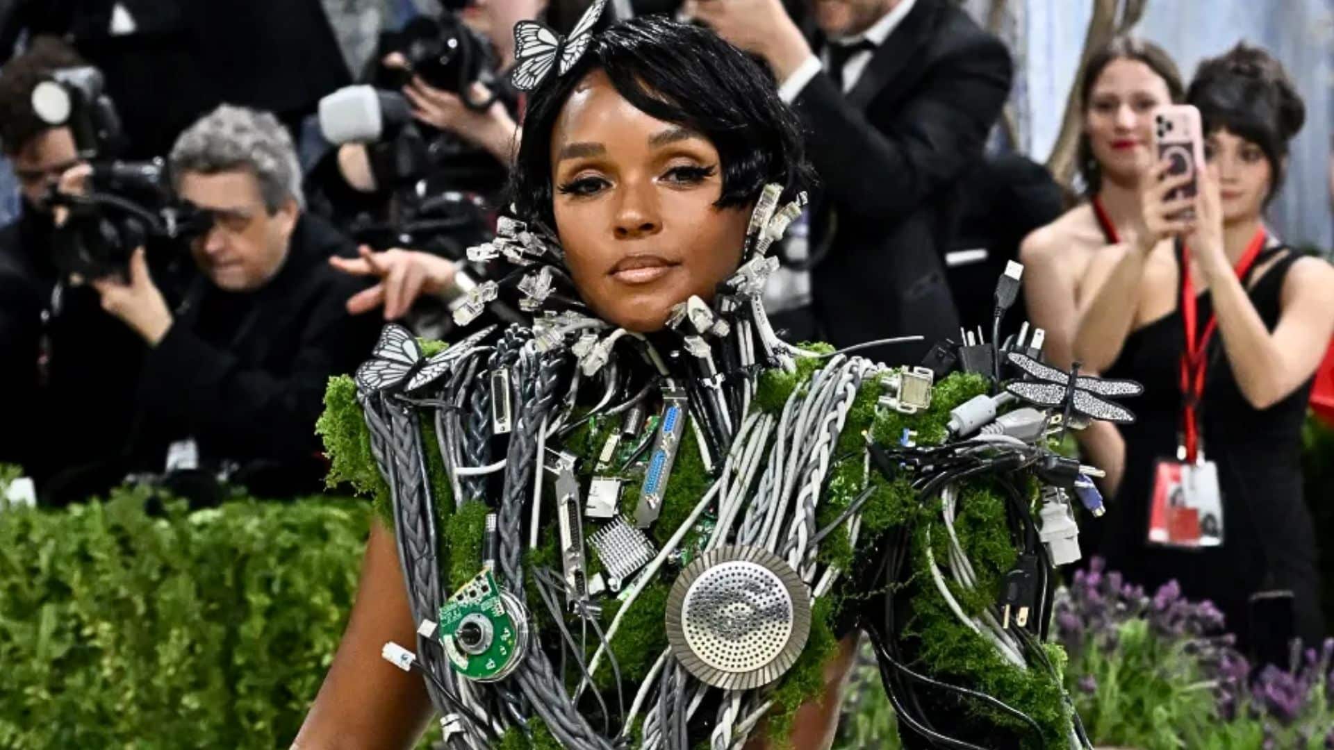 Janelle Monáe wearing a futuristic Christian Siriano design made of wires, moss, and electronic