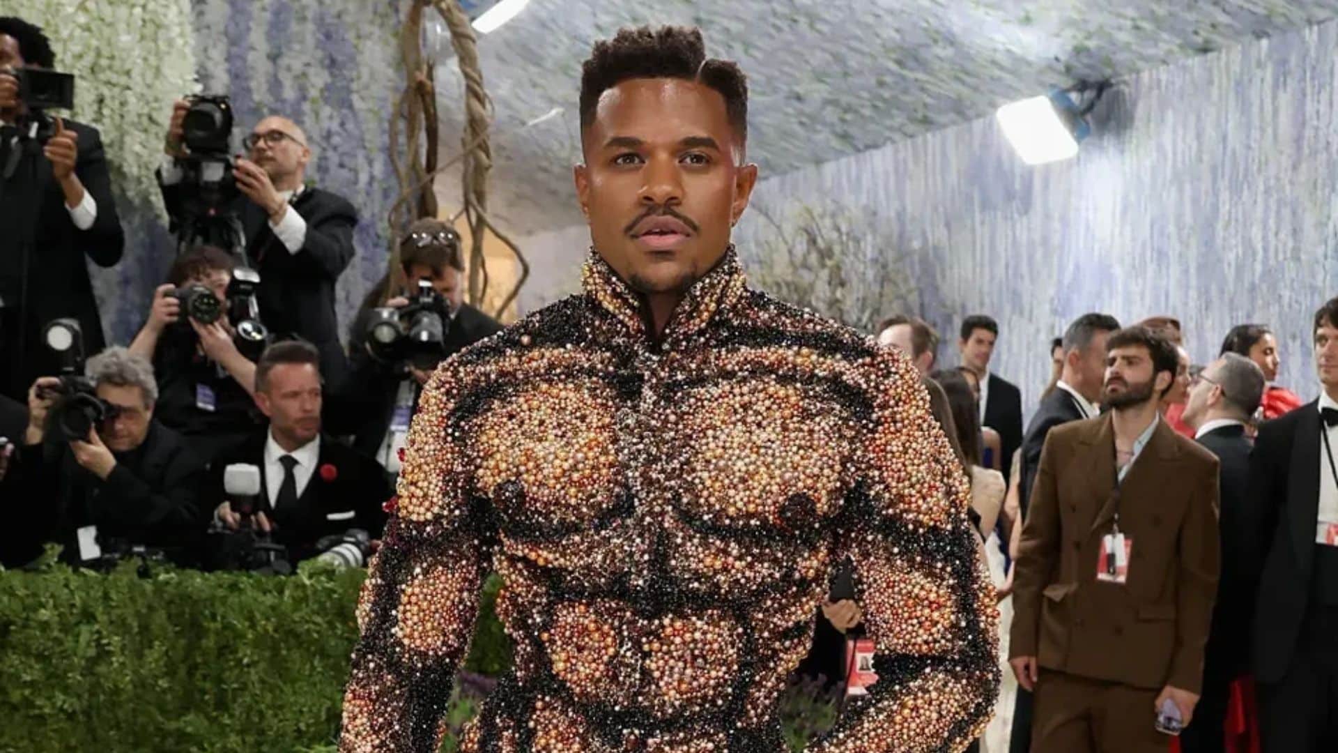 Jeremy Pope wearing a crystal-embellished Vivienne Westwood look sculpted to resemble a muscular torso at the Met Gala