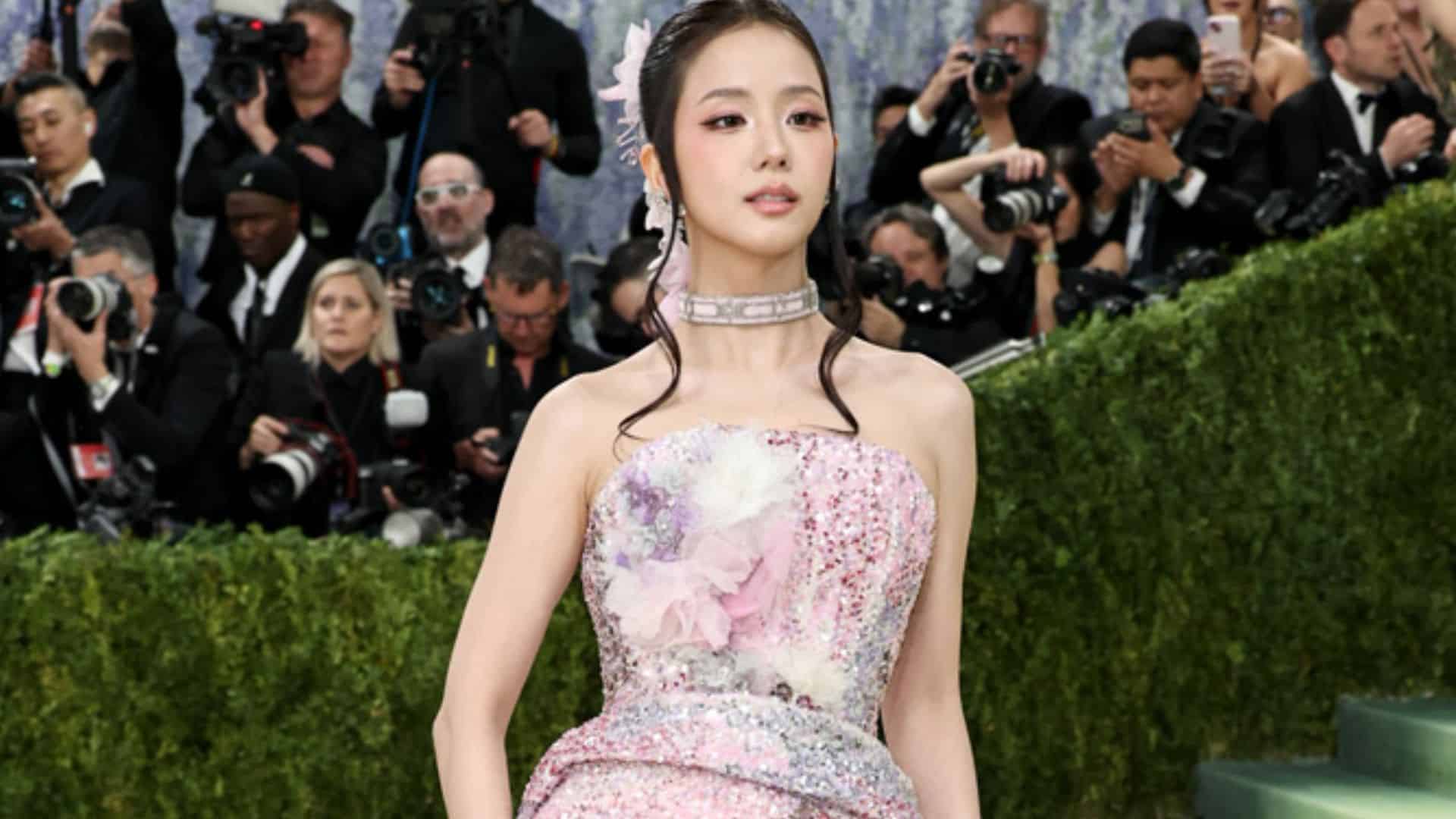 Jisoo wearing a pastel embellished Dior gown with floral detailing and crystal choker at the Met Gala