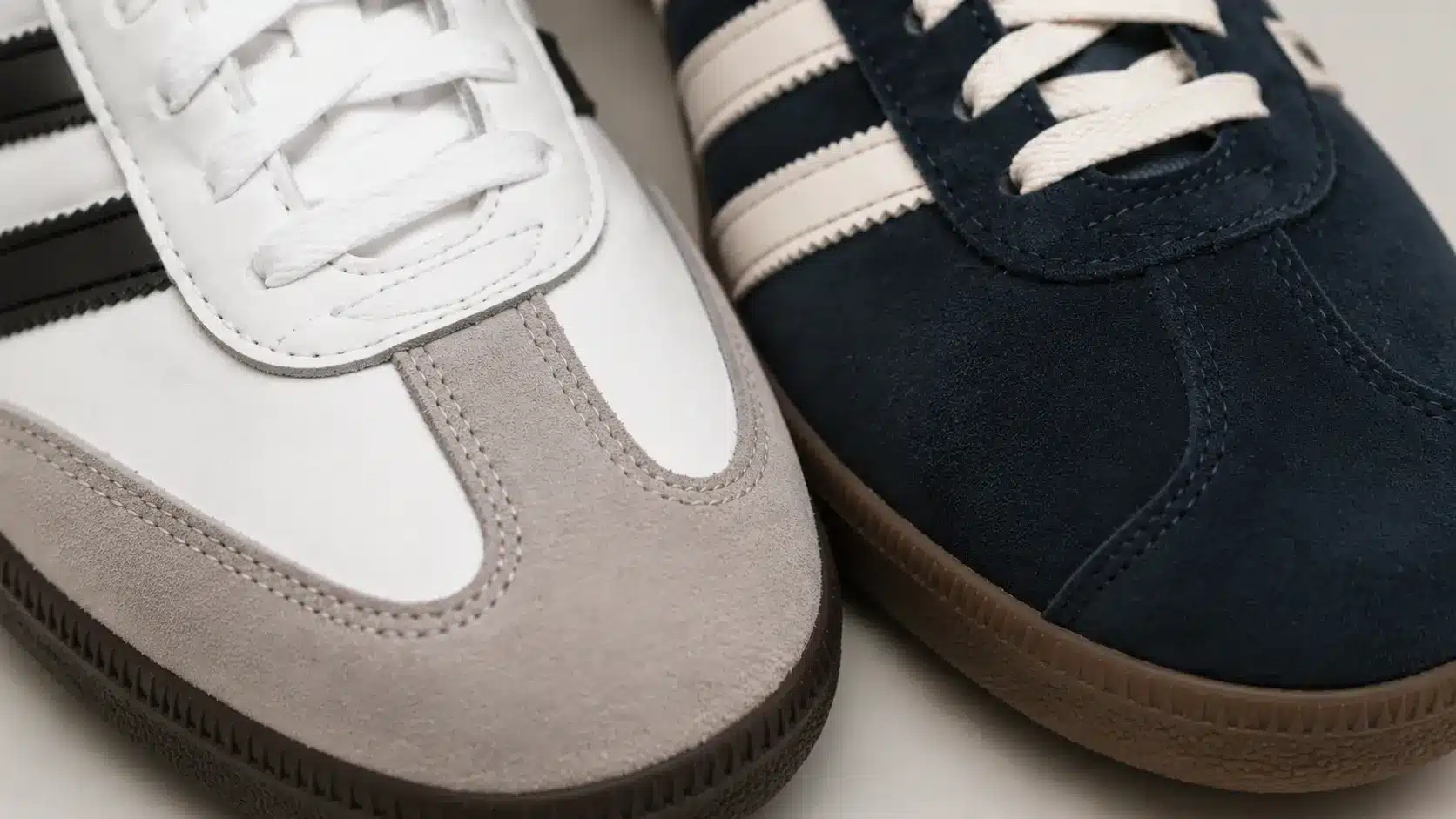 Leather Adidas Samba beside suede Adidas Gazelle showing material differences