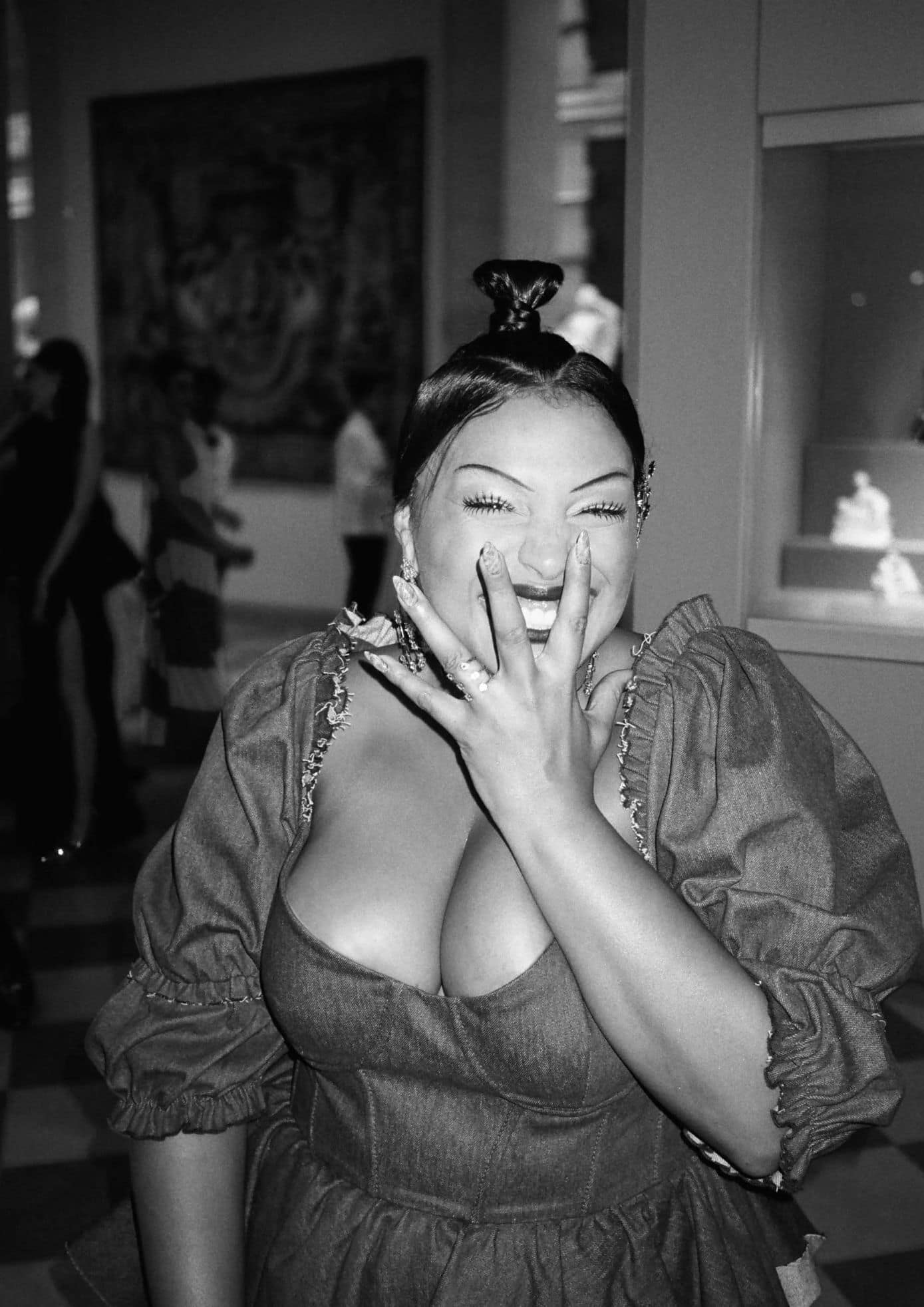 Normani laughing and posing in a denim gown with sparkling jewelry at the event. (1)