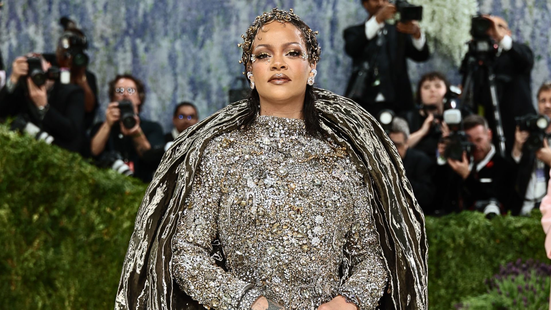 Rihanna wearing an ornate crystal-embellished Maison Margiela ensemble with sculptural outerwear at the Met Gala 2026