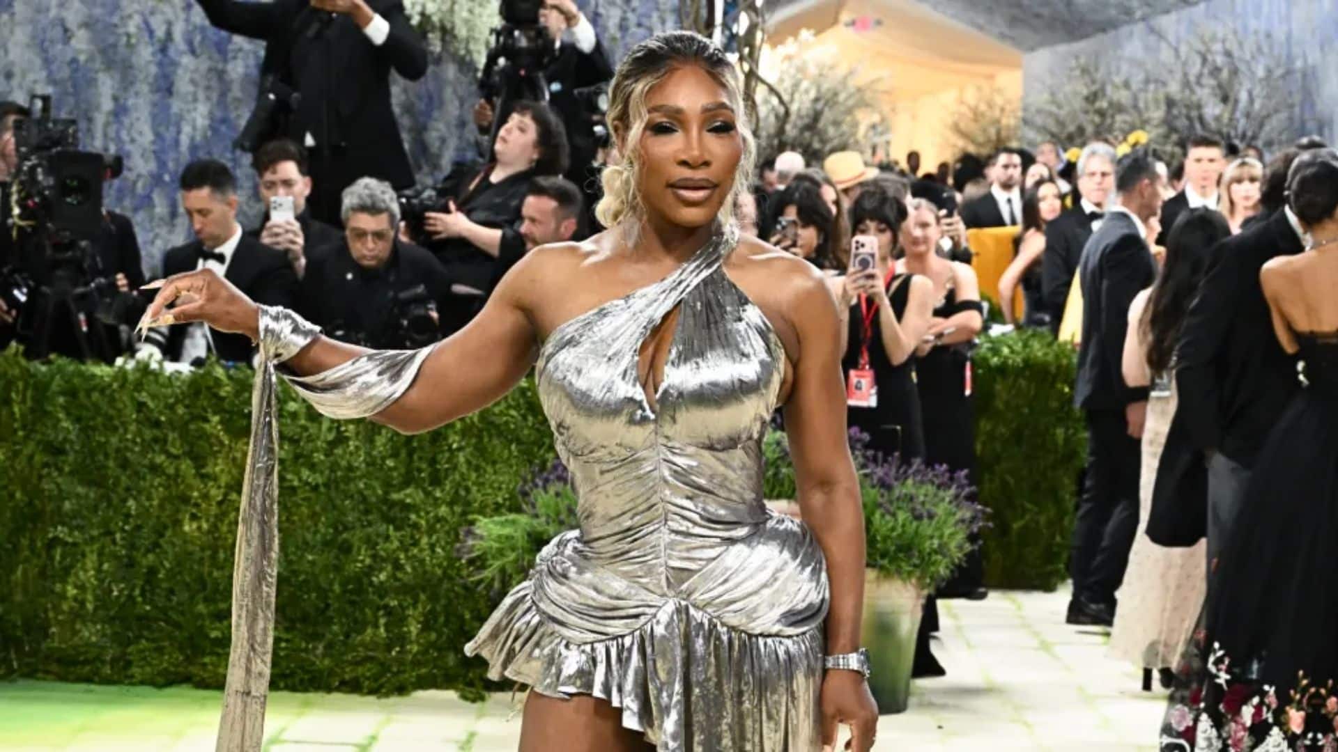 Serena Williams wearing a metallic silver Balmain mini dress with draped detailing at the Met Gala