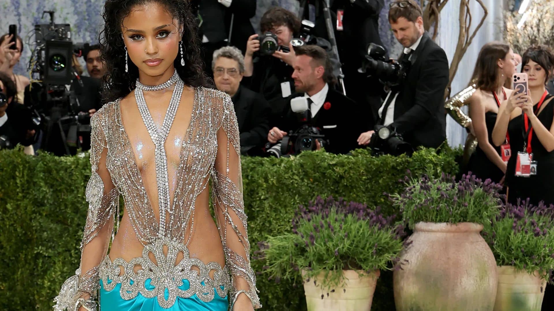 Tyla wearing a turquoise Valentino gown with crystal embellishments and sheer draped detailing at the Met Gala