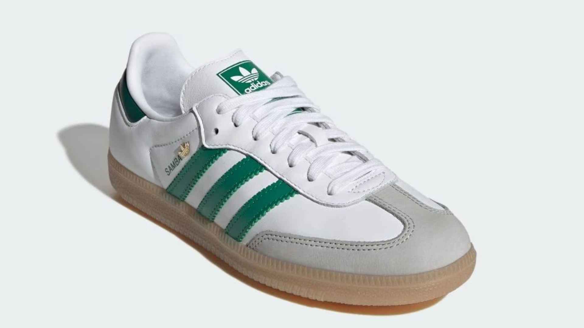 Clean white Adidas Samba sneakers with suede and leather retro low-profile design.