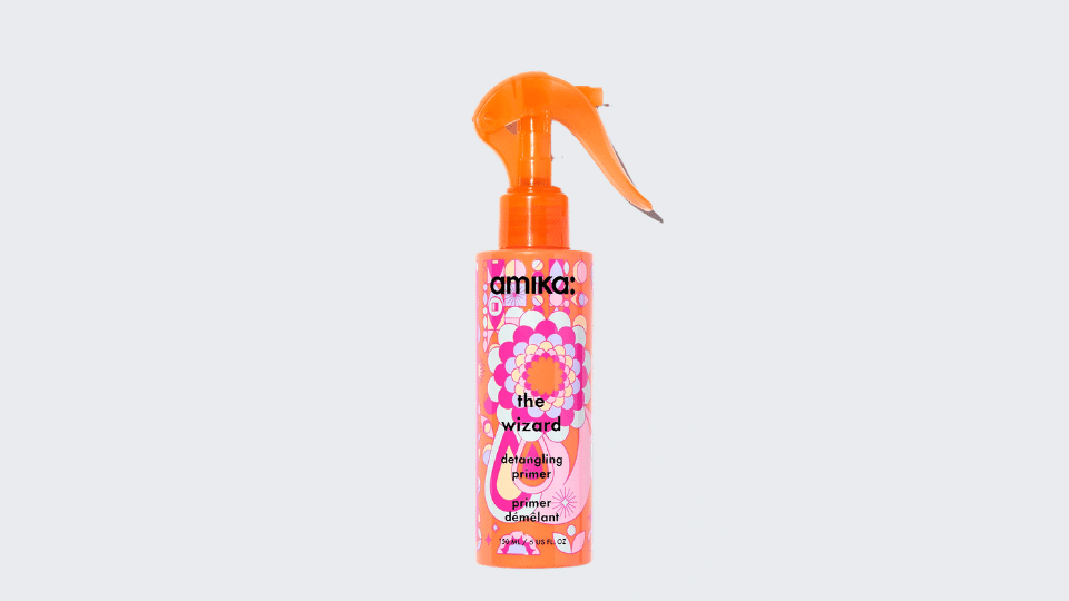 amika The Wizard Detangling Primer bottle on plain background