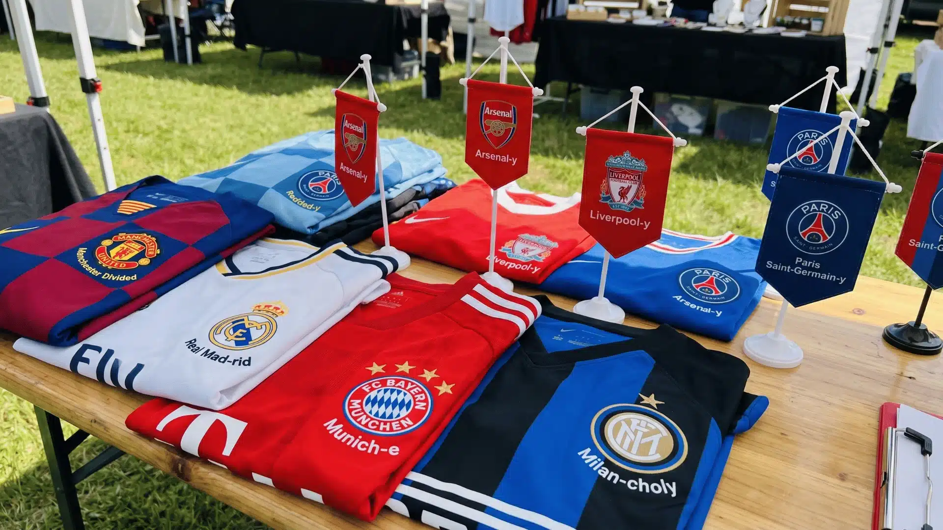 Soccer jerseys and flags showing funny twists on famous club names.
