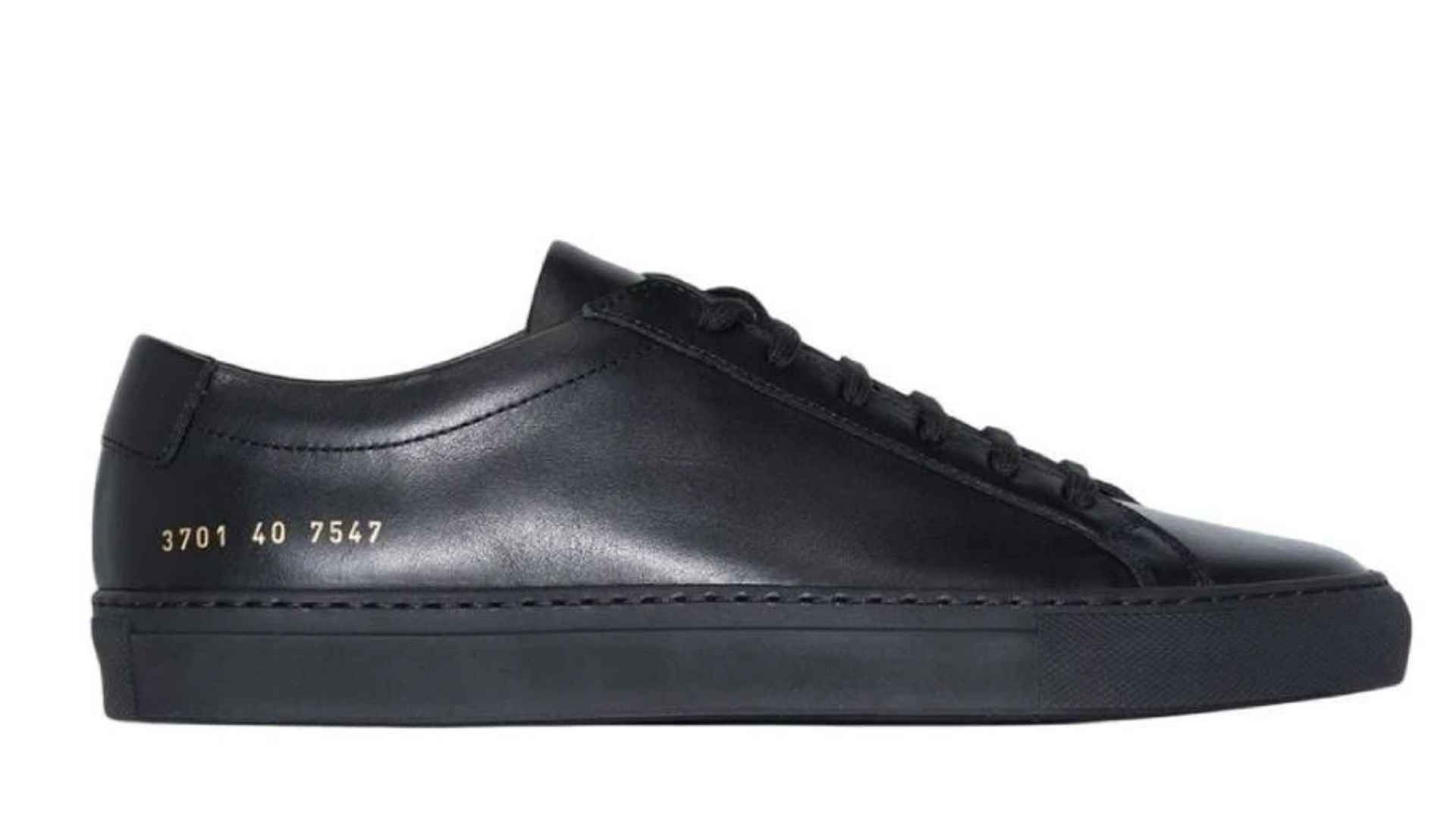Minimalist white Common Projects Achilles Low luxury leather sneakers clean design.