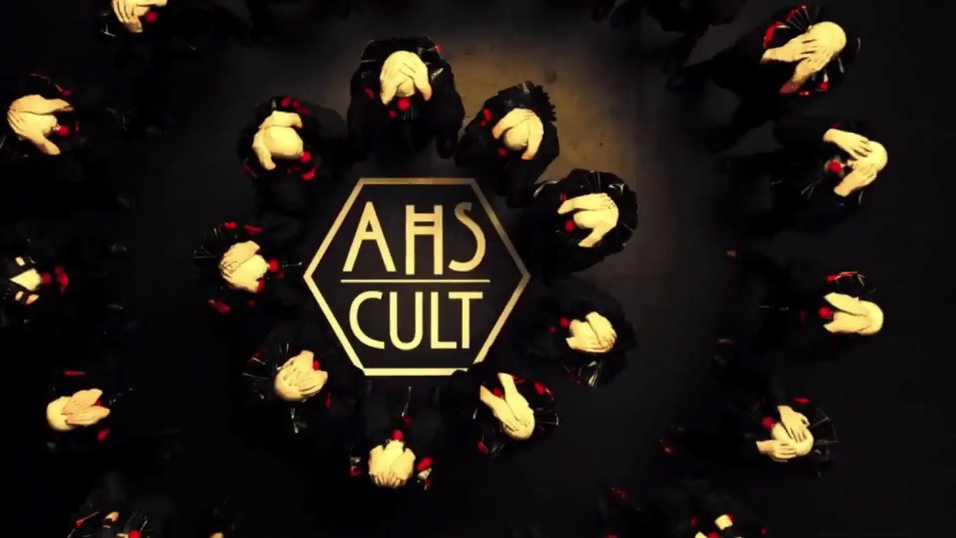 Top-down American Horror Story Cult poster showing figures in black arranged in a circle around a hexagon logo reading AHS CULT.