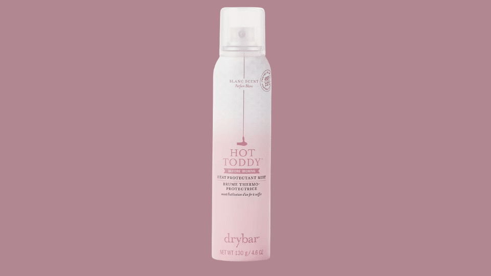 Drybar Hot Toddy Heat Protectant Mist bottle on plain background