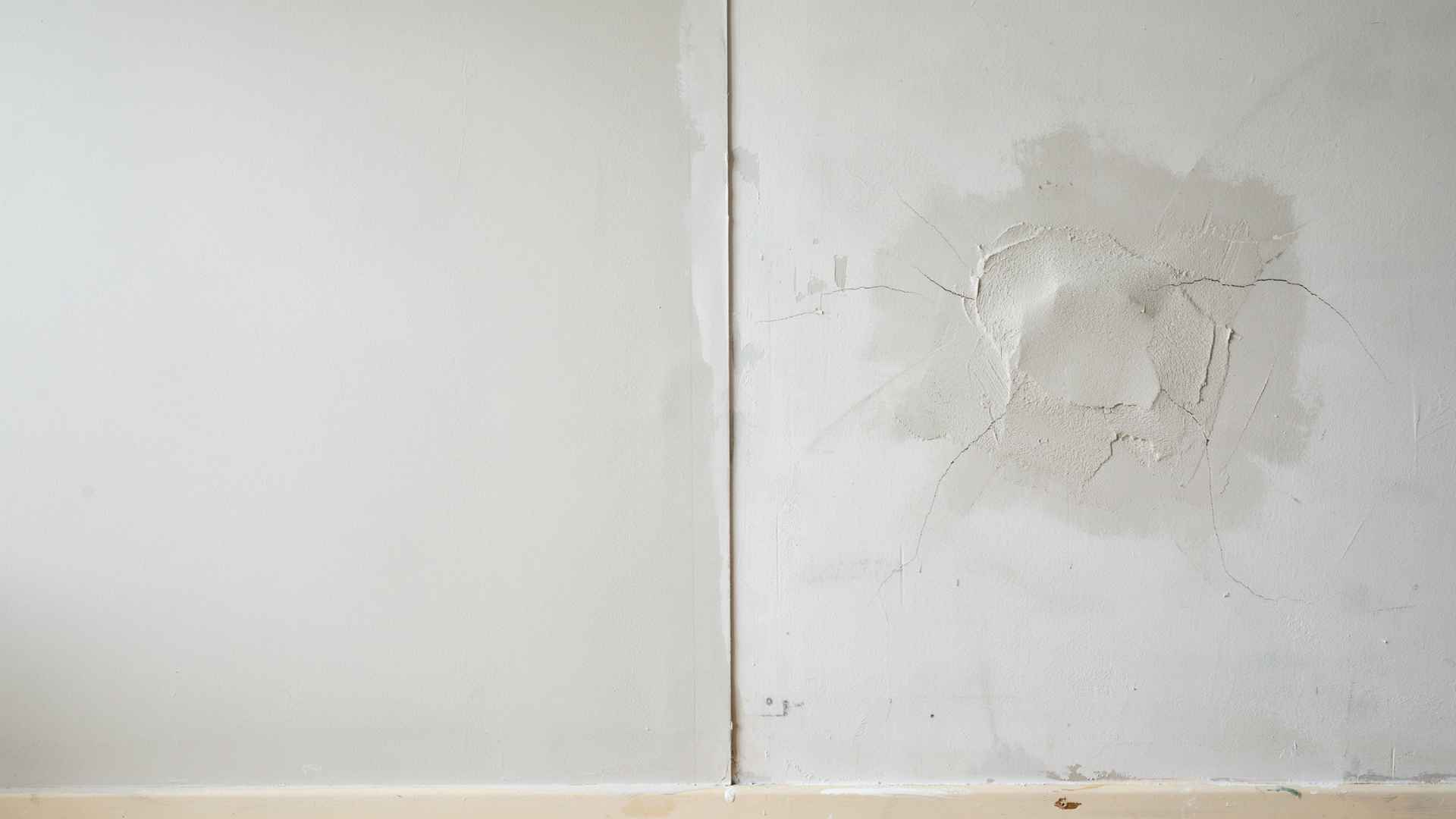 Comparing smooth finished drywall patch versus uneven cracked patch