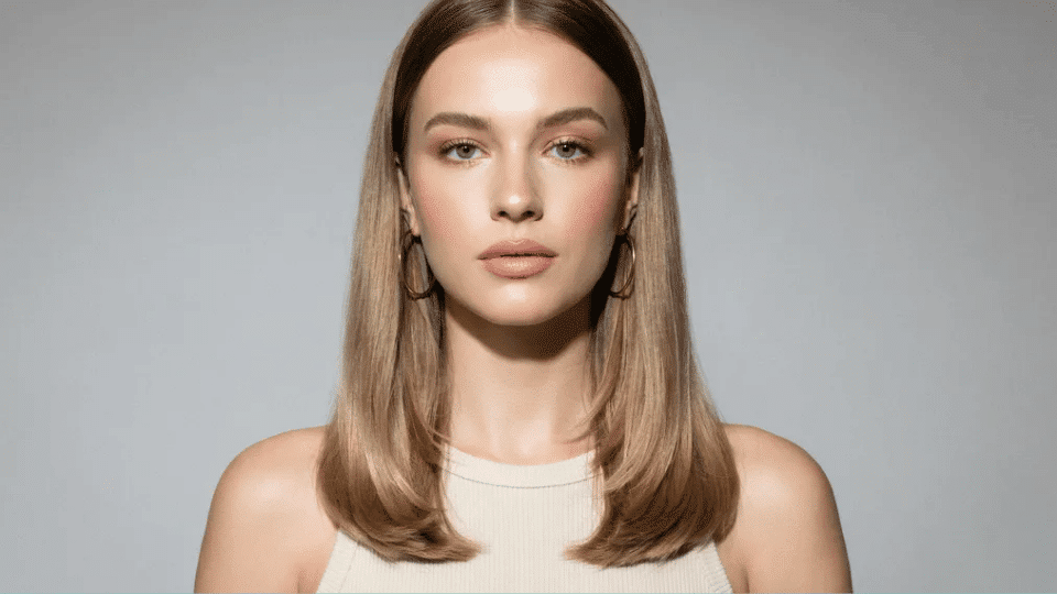 Glossy straight hair with soft face framing layers, smooth Y2K soft glam hairstyle with natural polished finish look