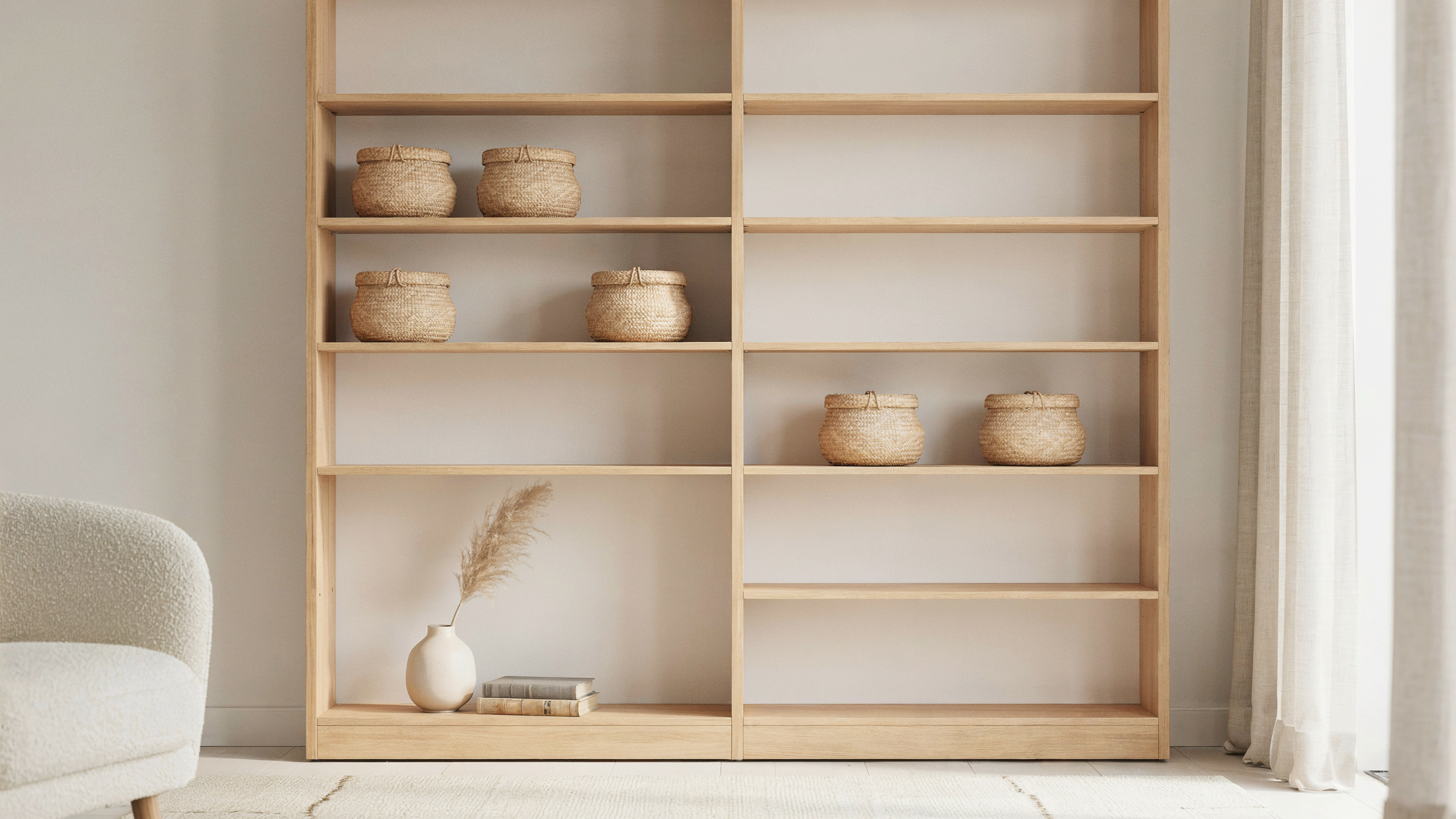 Open shelves with matching baskets neatly storing items, creating an organized, uniform look that reduces visual clutter in a bright, simple living room.