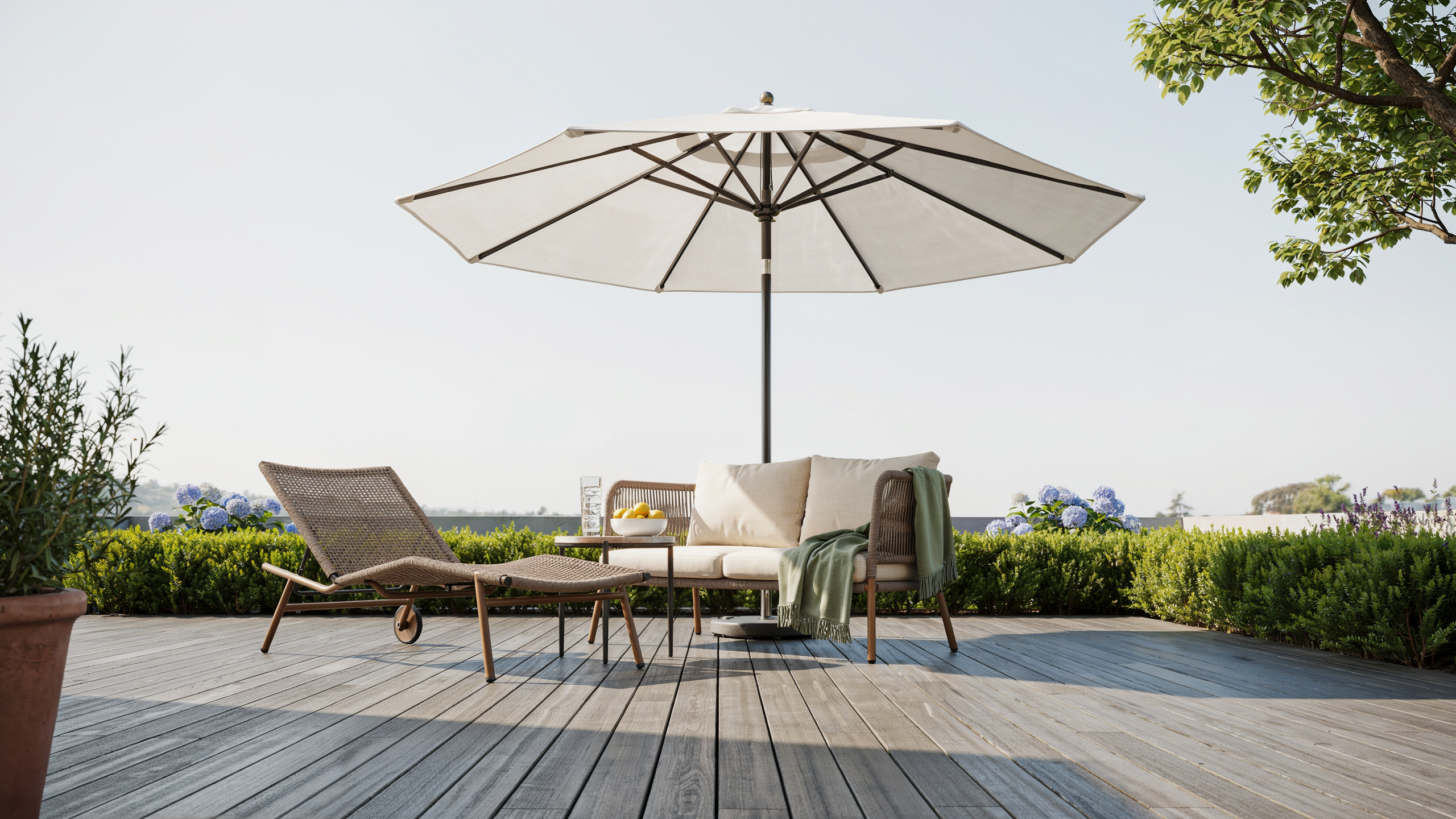 Clean open outdoor umbrella on a deck with patio furniture, no people.