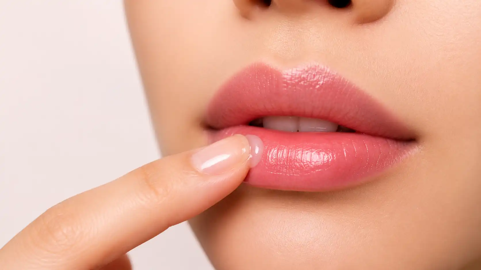 Applying healing balm to lips during lip blush tattoo aftercare.