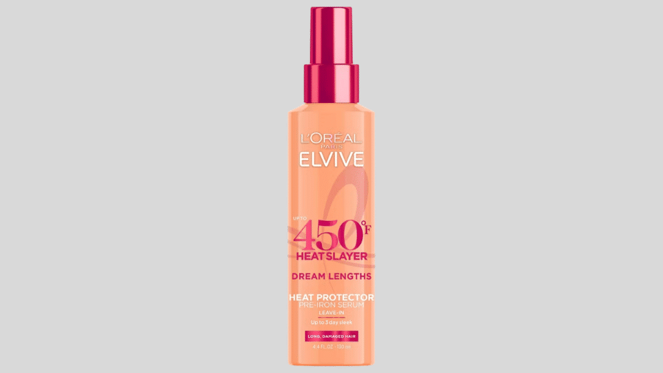 L'Oréal Paris Elvive Dream Lengths Heat Slayer Leave-In Spray bottle on plain background