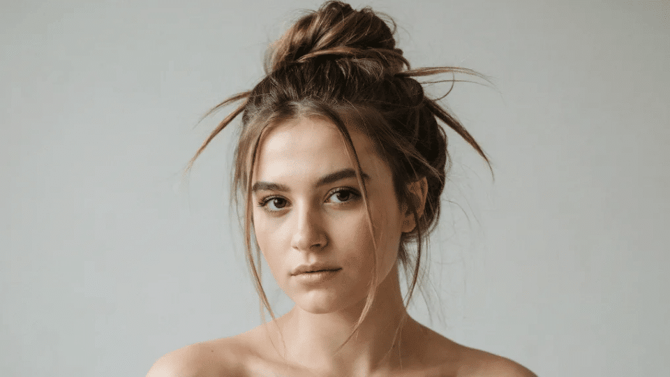 Messy updo with soft undone texture and loose strands, edgy Y2K hairstyle with relaxed punk inspired vibe look