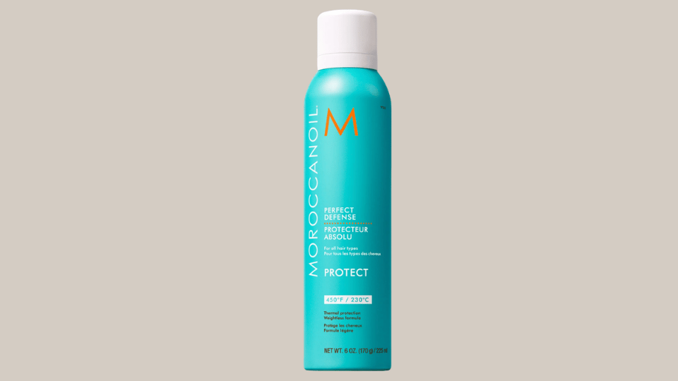 Moroccanoil Perfect Defense heat protectant bottle on plain background