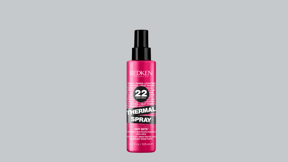 Redken Thermal Spray High Hold bottle on plain background